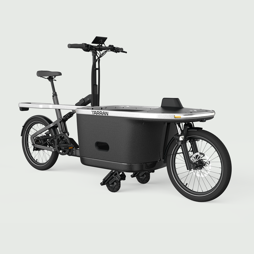 TARRAN T1 Pro e-cargo bike in Stardust Silver & Black with cargo box and stabilizing wheels.